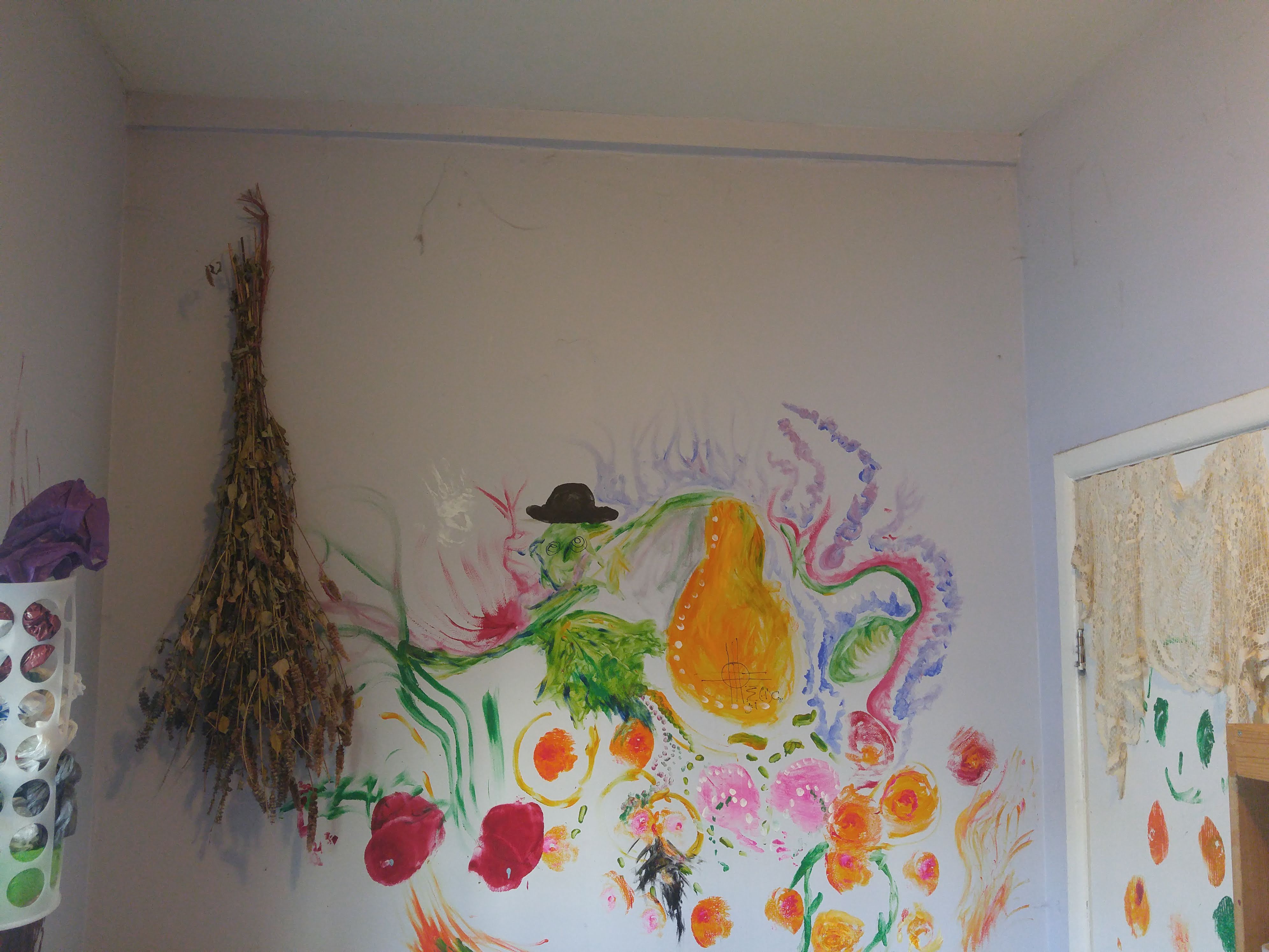 The pantry, with a giant painting of vegetables on a wall.
