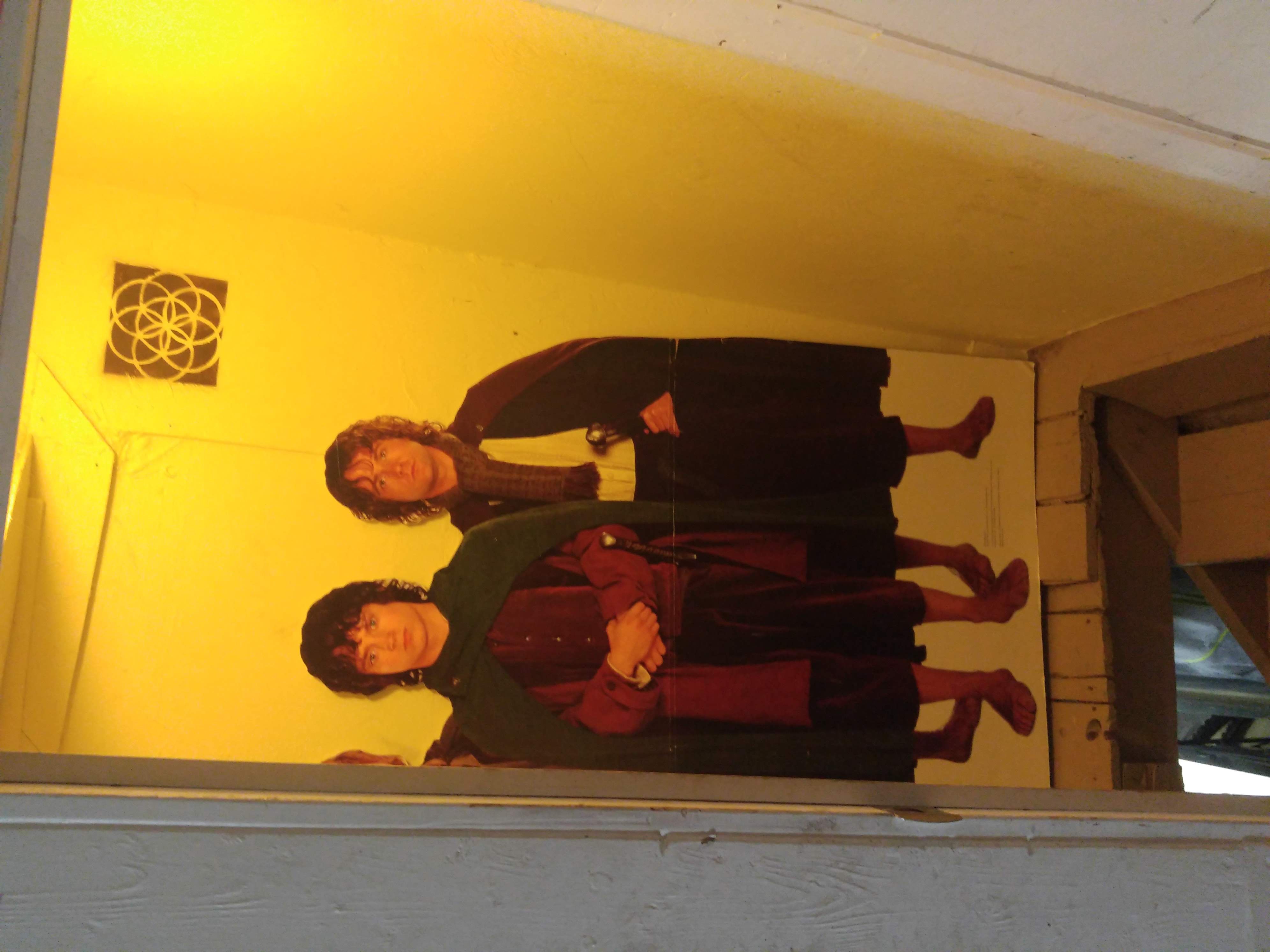The door to the basement, with a giant cutout of the hobbits inside.