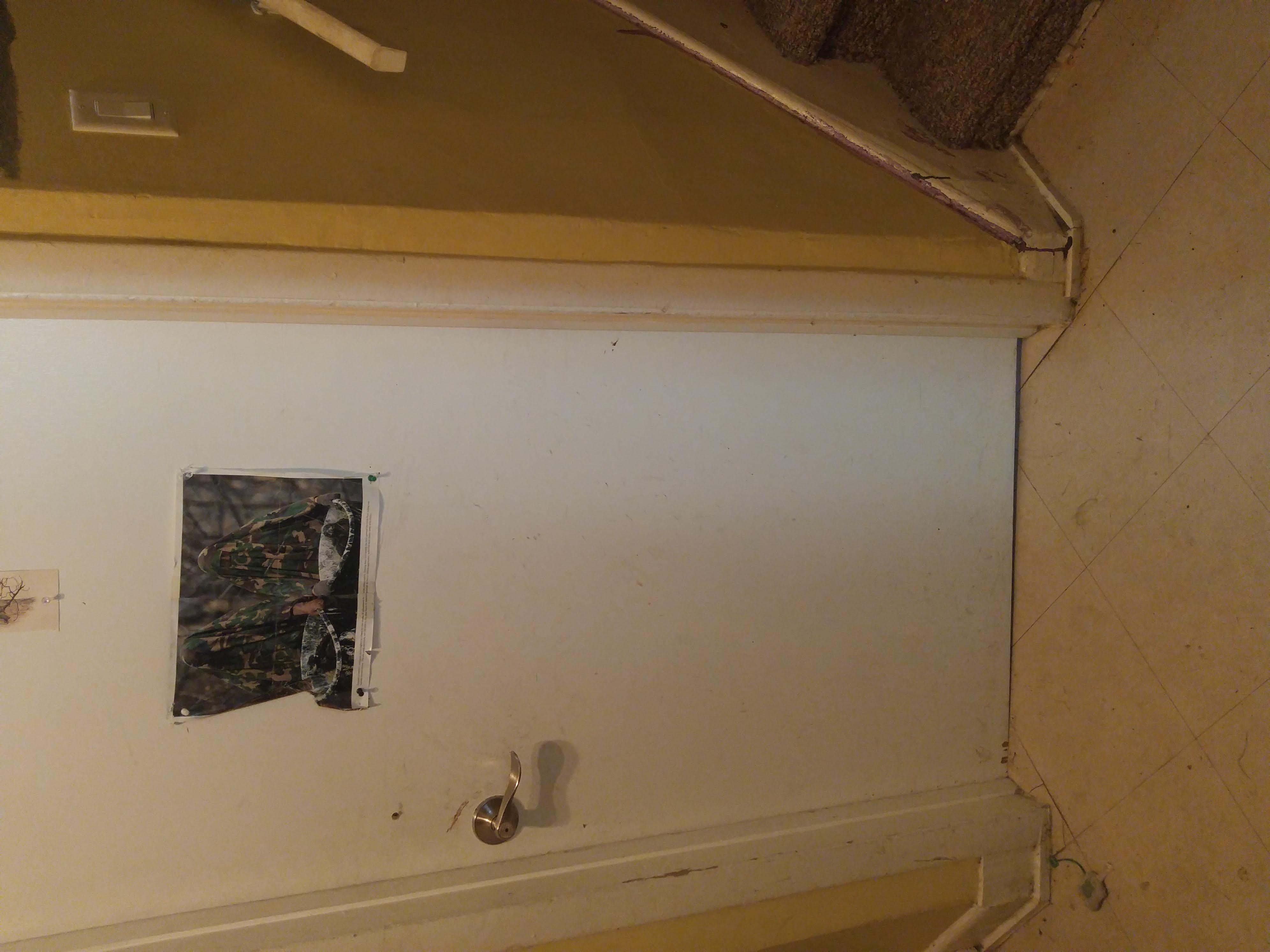 The bottom of that door, and the stairs leading to the upper floor