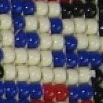 a blue atari mario sprite, in beads