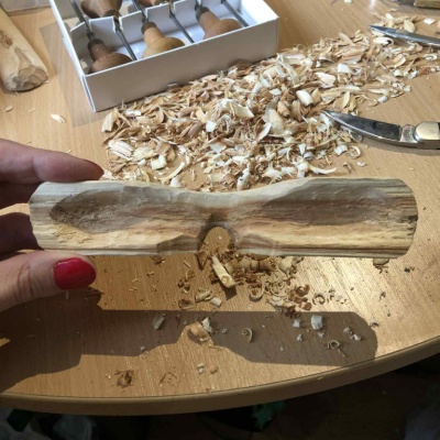 An unfinished pair of wooden snow goggles.