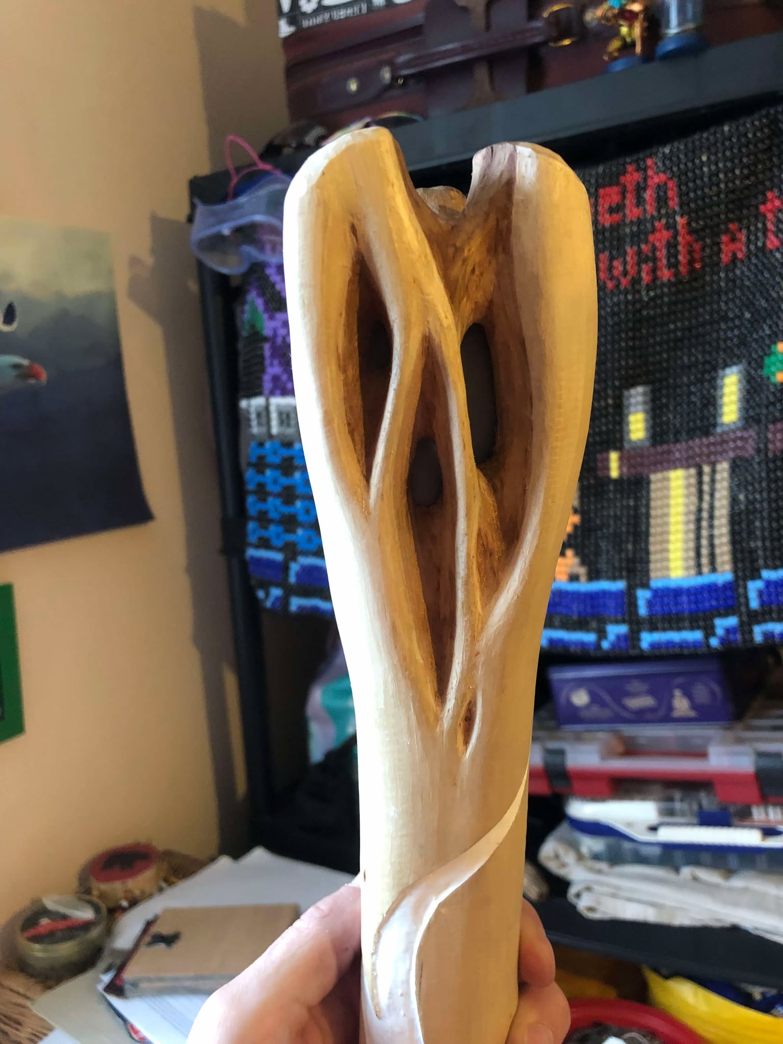 The head of the staff from the front, with the angelite stone set inside of it, filling all three of the front openings, deep enough to be below the top surface of the head.