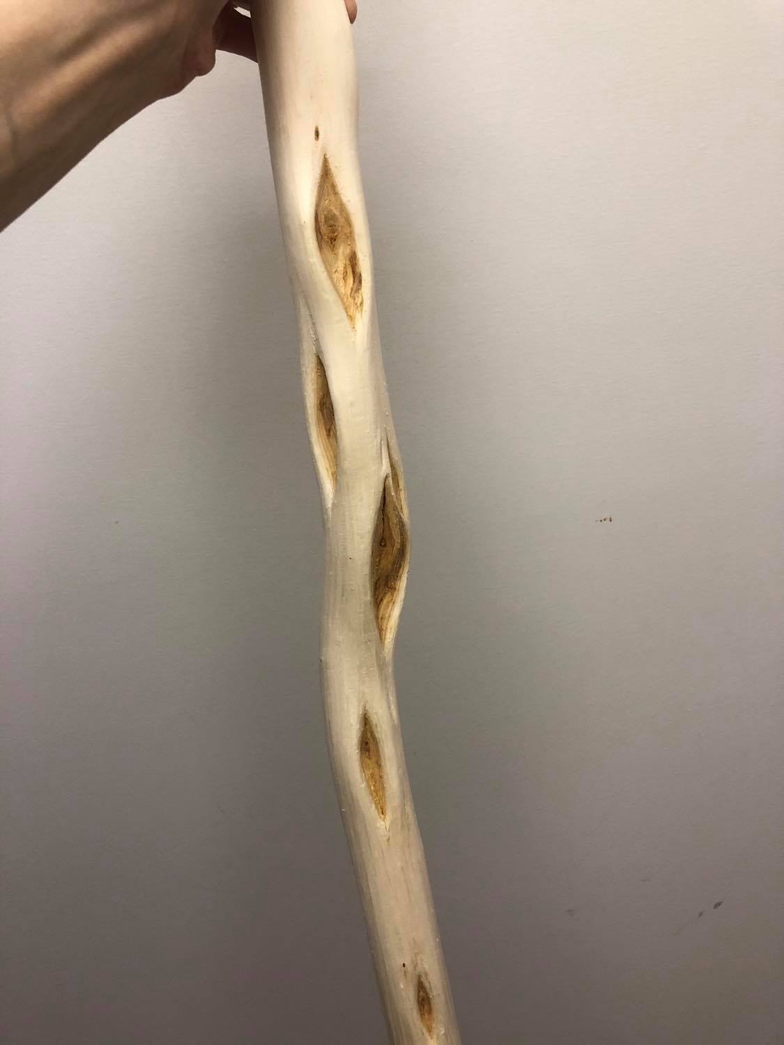 The middle of the staff, with the incredible eyes of the diamond willow wood.