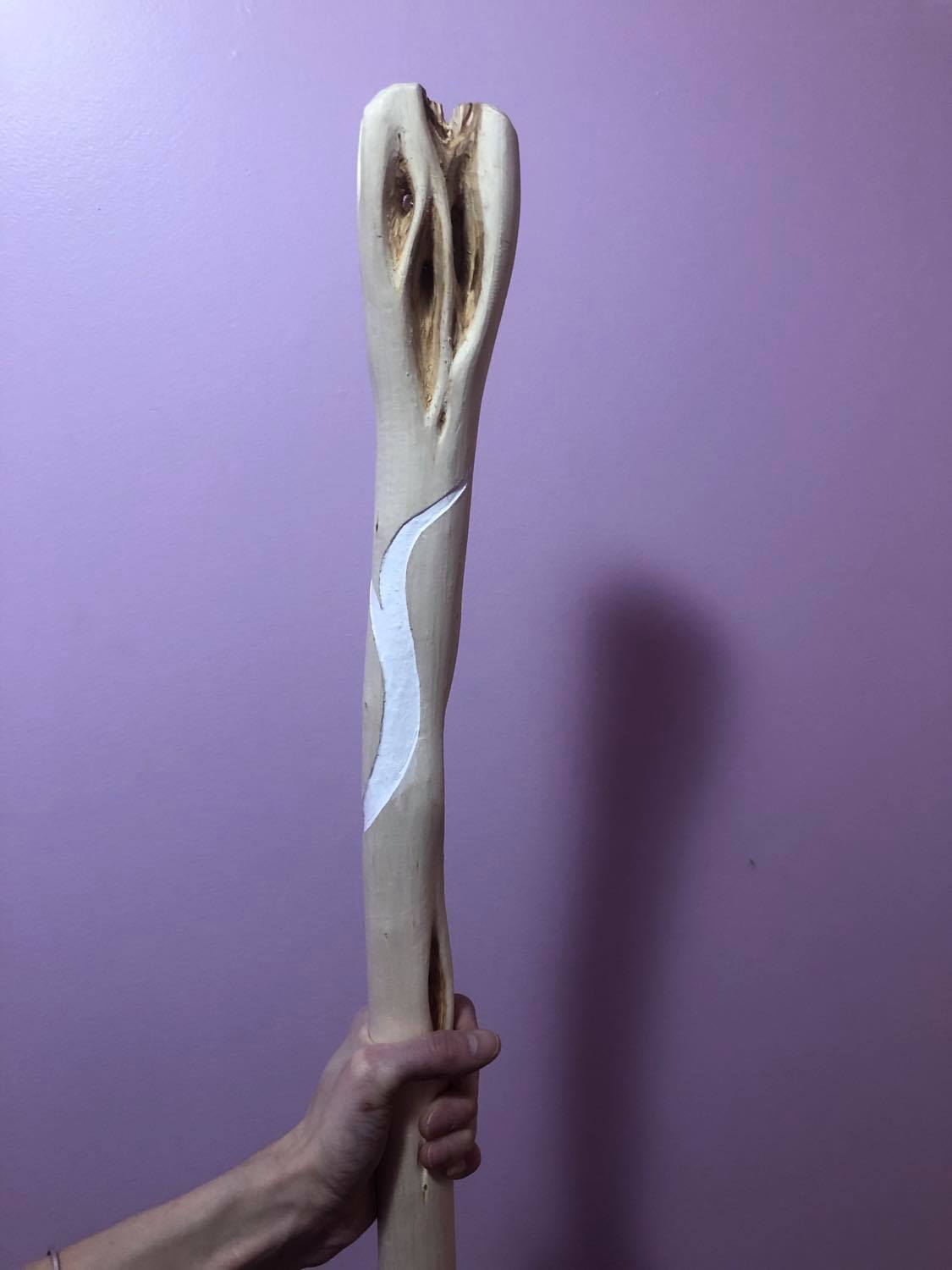 The linework beneath the head painted in with white.