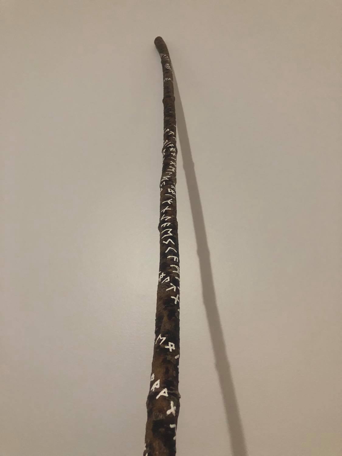 The staff, seeing some of the crazy linework swooping and curving, with some lines being close to others, and showing about 30 runes in this pic.
