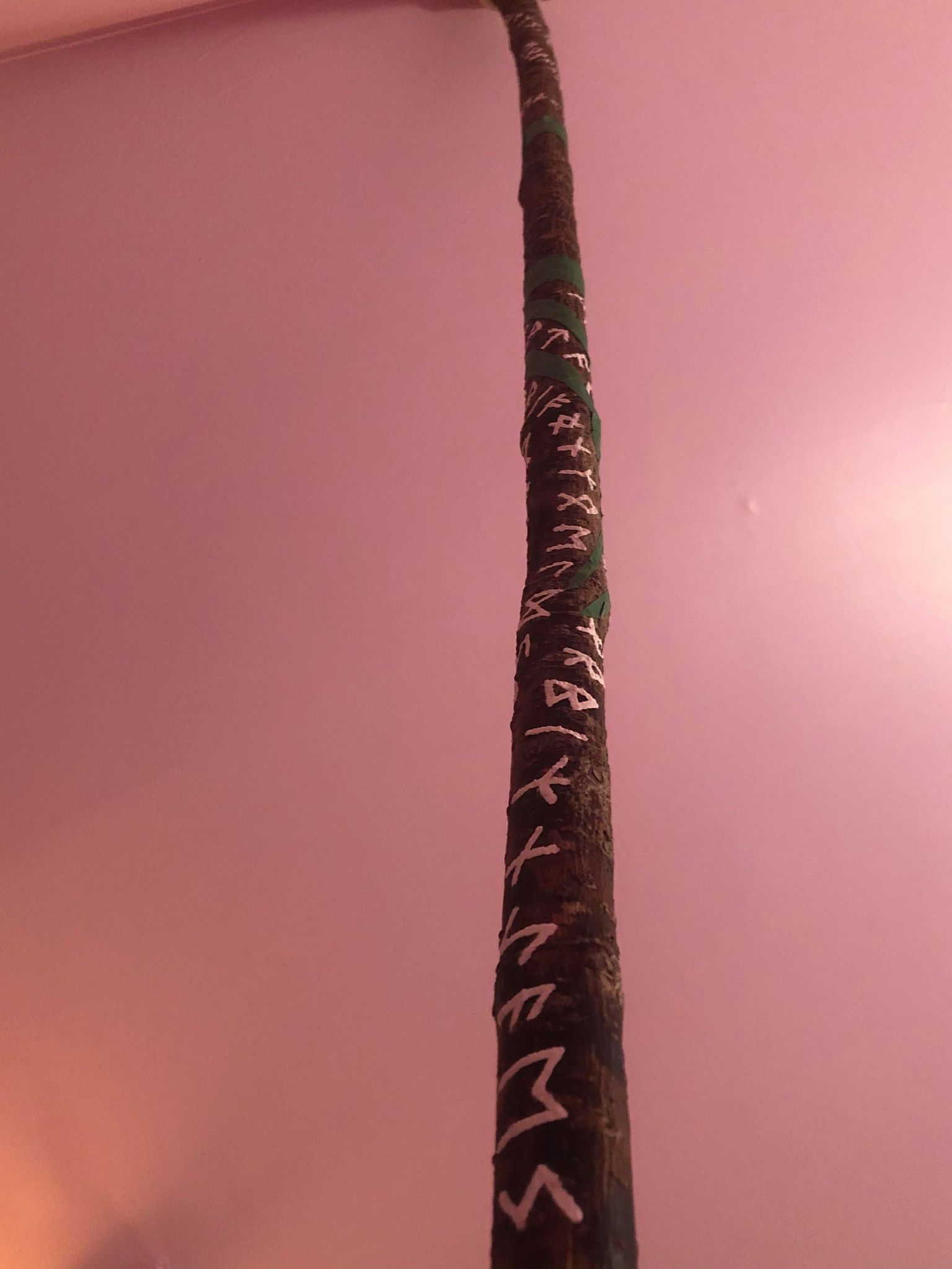 The staff, with tape partially removed from the sides.