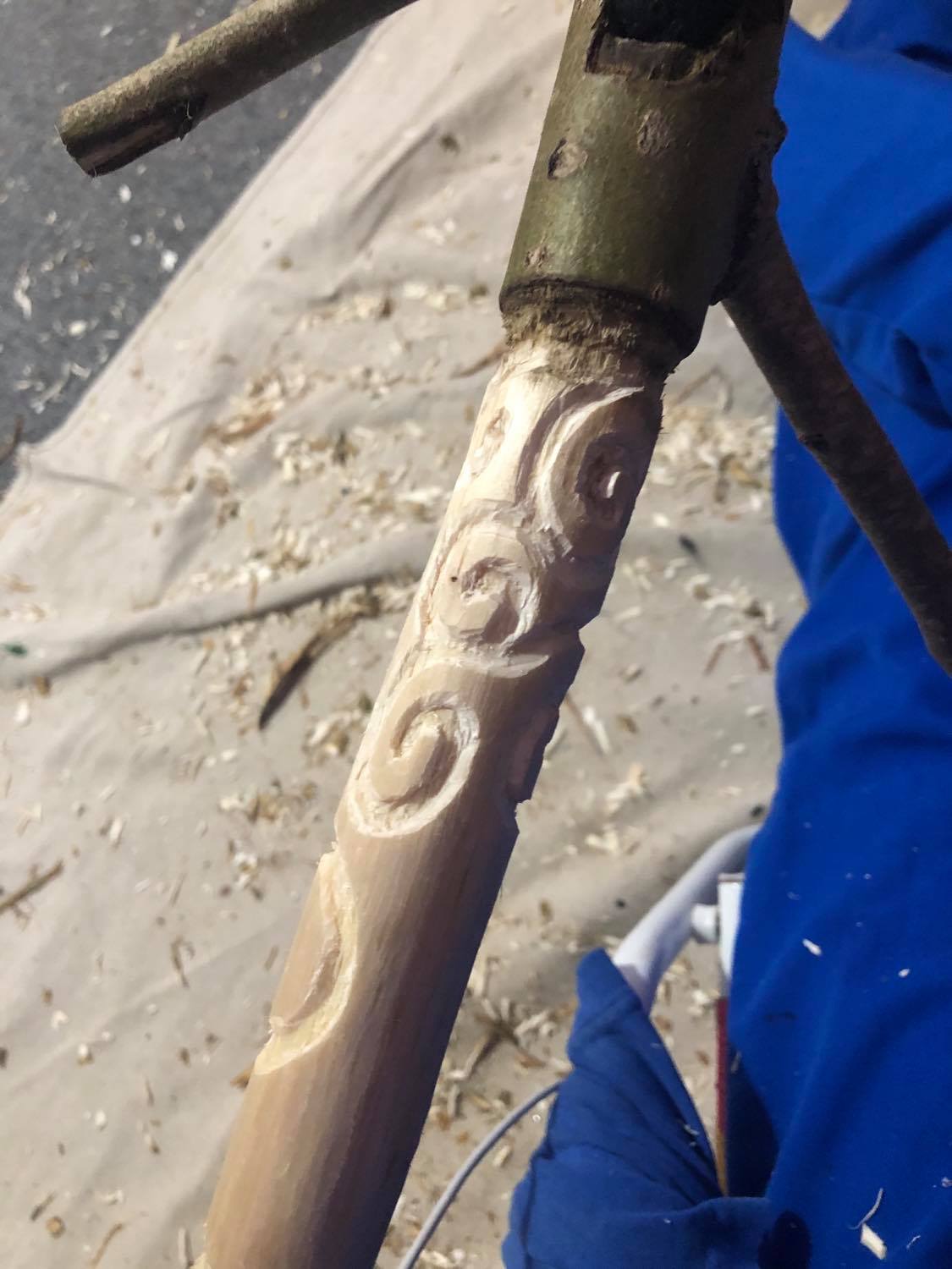 Beginning the scrolling linework on the handle.