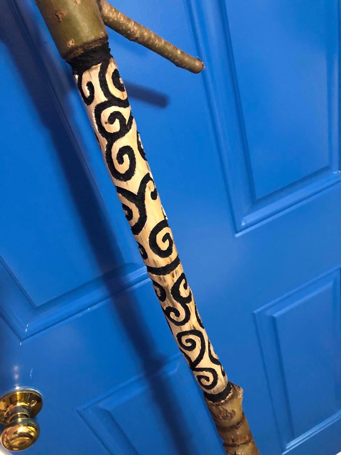 A closeup of the handle, with all of the linework filled in black.