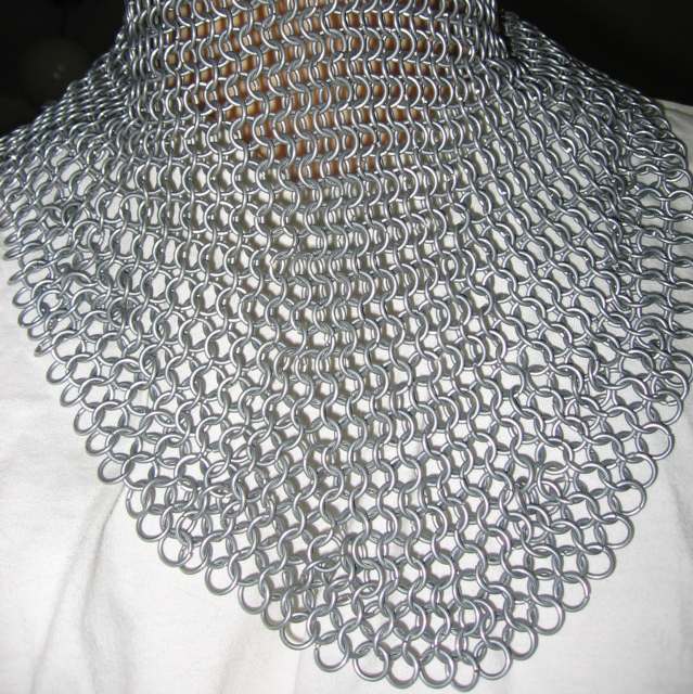 A closeup of the neck portion of the coif, showing the expansions and contractions in the weave.