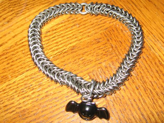 The second chainmaille collar, with the bell attached on the bottom, and breakaway ring.