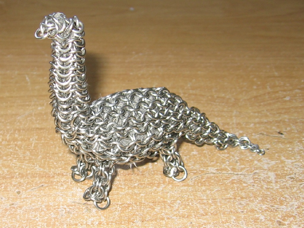 The dinosaur from the front and side, looking strong and proud.