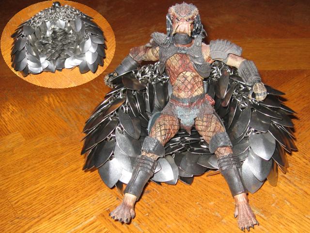A little Predator figure sitting on the purse dented in to create a couch shape, with an inset view of the couch it makes.