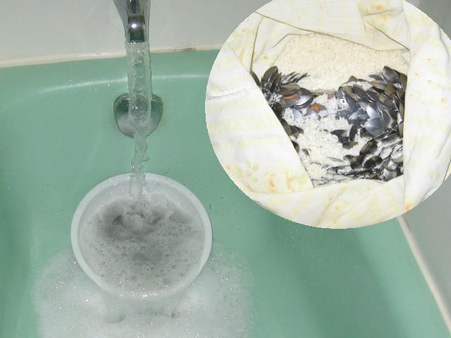 Showing the purse sitting in a soapy bucket in a bathtub with water pouring onto it, and a cutaway view of it being tumbled around in rice to clean it.