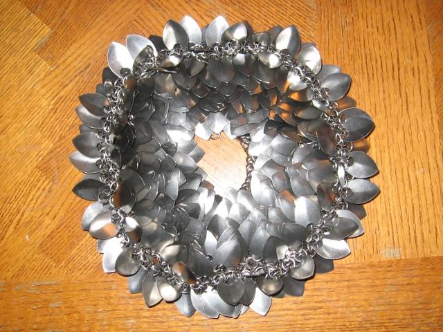 The purse a little bit more clumped up on the table, as the weave starts to close in again.
