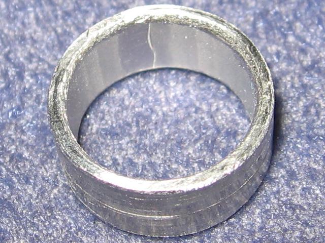 The ring with the inside edges rounded and smooth.