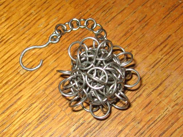 A closeup of a single, very complicated tetra orb, with many many protruding rings connecting the sides, rather than the usual six.