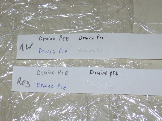 The draino pre soak pieces of paper, sitting on plastic.