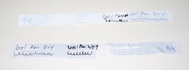 The two strips of paper, with the regular paper bleeding the ink a bit, but the all weather paper has irregular splotches.