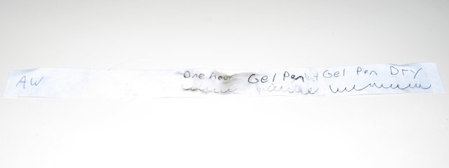 The gel pen paper, with one hour and a scribble written on it, slightly lighter than the five minute line.
