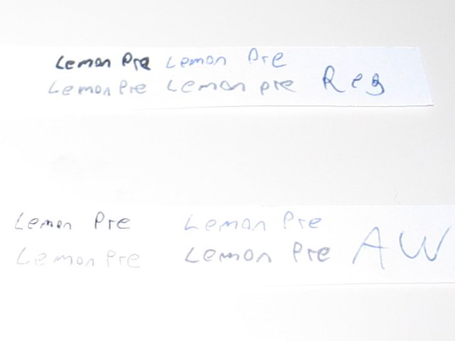 The two papers, showing the pre lemon juice text with the three pen and a pencil types.