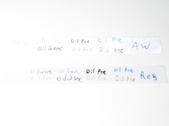 The papers with very faded text in the two second area.