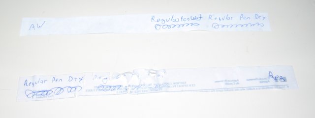 The two strips, with the regular paper being quite soaked looking and fragile.