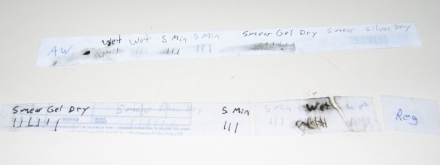 The two strips of paper, with the all weather quite smeared, but the regular paper blurry and broken apart in one spot.