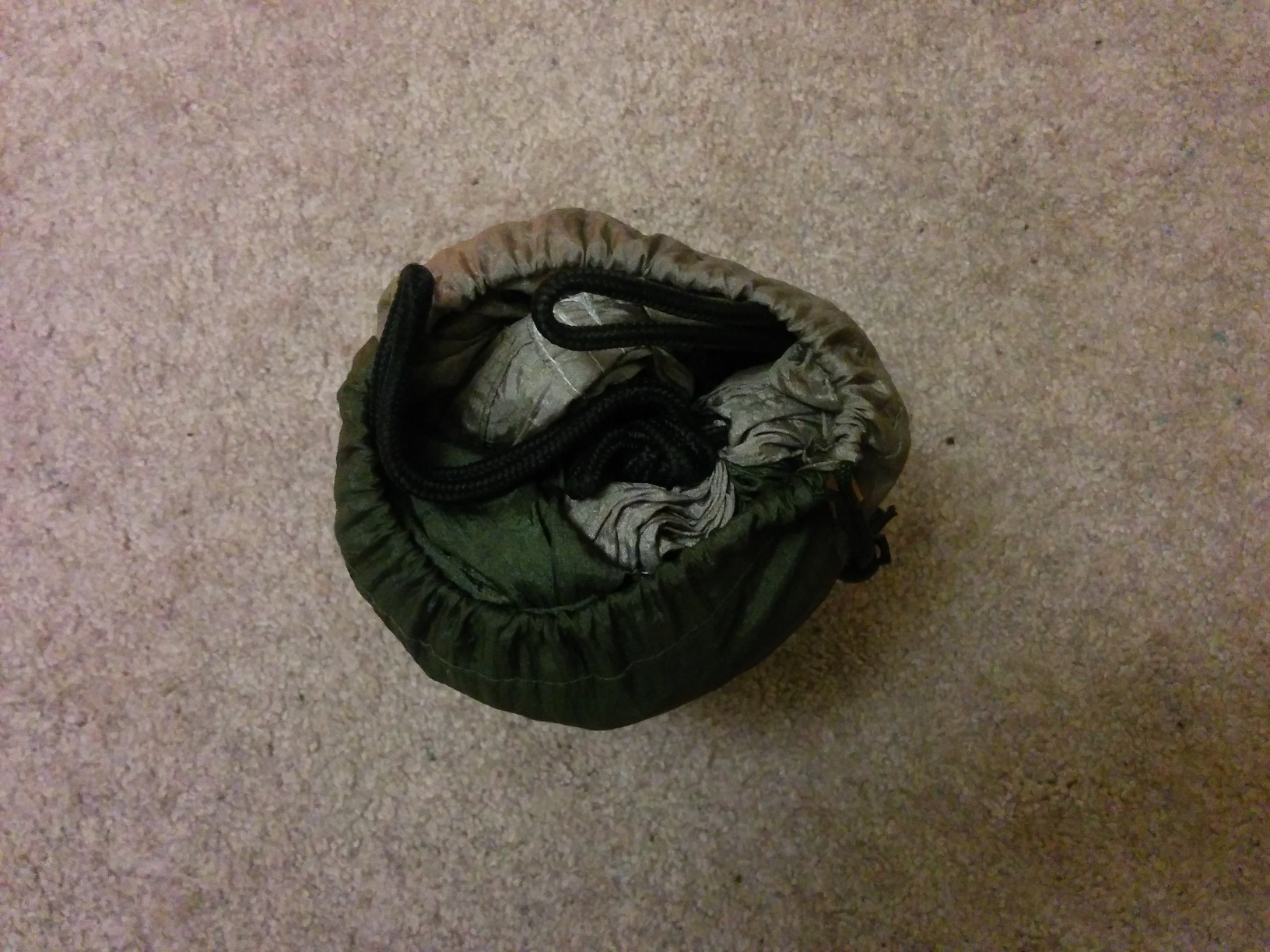 The pouch standing up and shown from above, with all of the fabric packed inside.