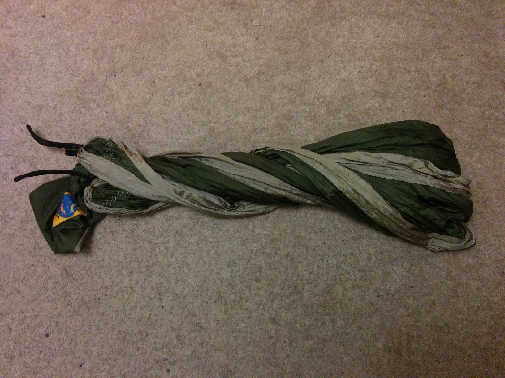 The fabric now twisted over twice, to keep the folds together.