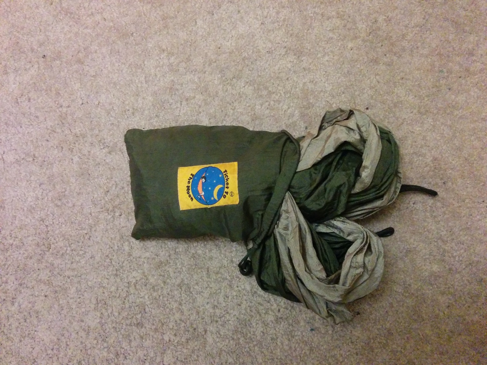 The fabric now mostly packed into the little pouch, with just a quarter of it remaining out.