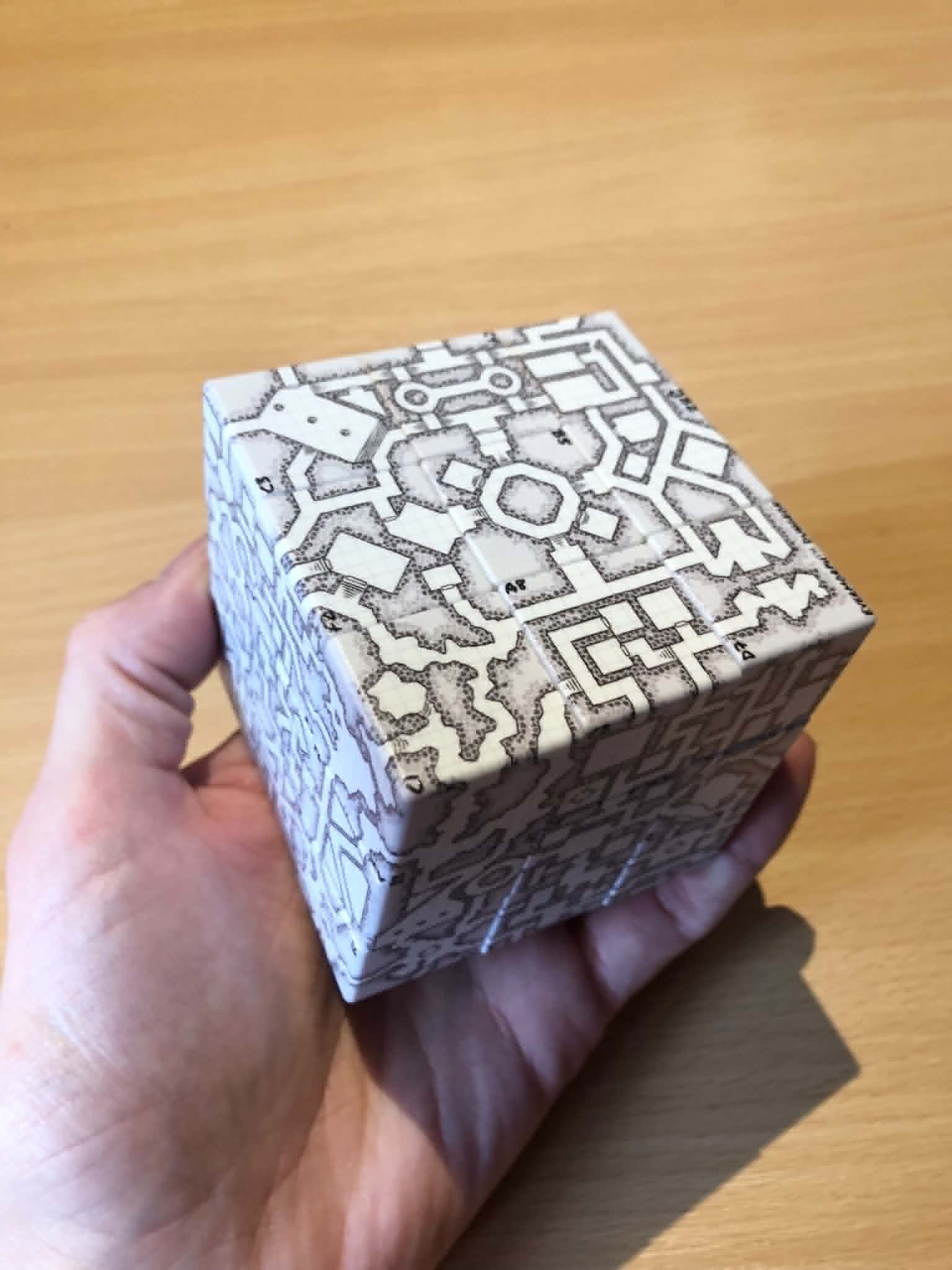 A grey shuffleable dungeon map on a Rubik's cube.
