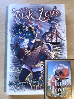 The far better dust cover with a hand drawn Oskar Fjord lovingly holding Guinevere Jester, staring deeply into eachothers eyes, with their pirate ship aflame in the background.