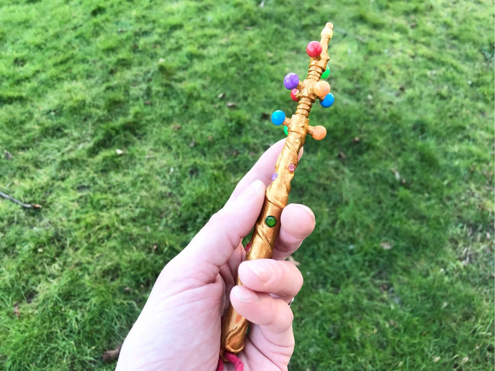 Looking down at your hand, you clutch the Wand of Wonder, a golden wand covered in magical linework and coloured jewels, knowing that it could cast almost anything.